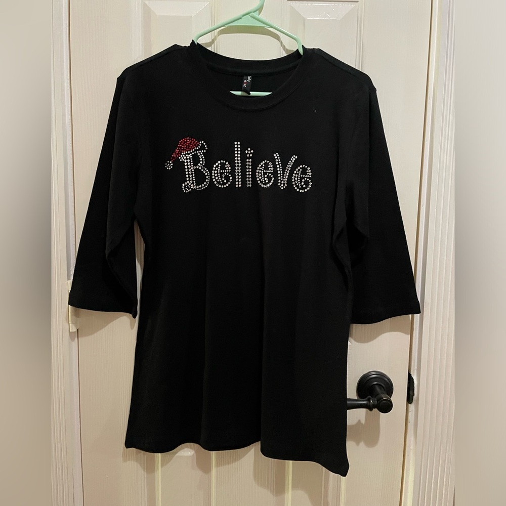 Black “Believe” Christmas sweater
